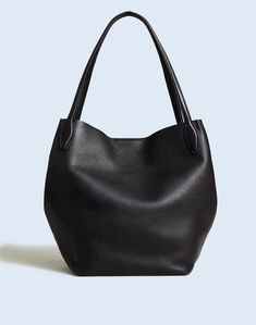 Perfectly luxe, our soft grain leather is tumbled for 48 hours to bring out the natural pebbling and then hand cut into the ultimate oversized shopper tote. Crafted with artisan details, it has collapsible sides that close with a dog clip that doubles as a key fob. It's spacious enough to hold your gym clothes, a large water bottle, phone, wallet and more—plus, it has shoulder straps.Leather.Magnetic closure.Interior pocket.9 1/2" handle drop.12 3/4"H x 12 3/4"W x 7 1/2"D.Imported. London In Spring, Madewell Tote, French Capsule Wardrobe, Large Water Bottle, Classic Capsule Wardrobe, Uniqlo Bags, Dog Clip, Fall Capsule Wardrobe, Gym Clothes