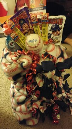 a baseball and other sports items in a basket