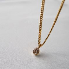 This Oval CZ Chain Necklace is perfect for any special occasion. Its sturdy cuban link chain and oval clear gem pendant make it a luxurious piece of jewelry. Crafted with high quality stainless steel, its classic design is sure to become a beautiful statement piece in any collection. -stainless steel, gold plated -16.5" in length, 2" extender Elegant Oval Pendant Stainless Steel Jewelry, Elegant Stainless Steel Oval Pendant Necklace, Elegant Stainless Steel Oval Pendant Jewelry, Elegant Oval Stainless Steel Pendant, Luxury Gold Chain Necklace With Oval Pendant, Elegant Stainless Steel Necklace With Cuban Link, Classic Gold Chain Necklace With Oval Pendant, Elegant Stainless Steel Chain Necklace With Oval Links, Gold Oval Stainless Steel Necklace