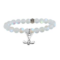 a white bracelet with an x charm on it