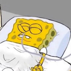 the spongebob is laying in bed with his eyes closed