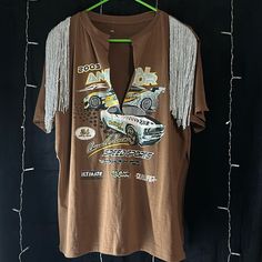 Trendy Cut Sleeve T-Shirt Brown With Race Car Detail Fringe Detail & Slit Up The Sides Size: L/Xl Brand New Without Tags Car Detail, Cowgirl Style Outfits, Upcycled Clothes, Clothing Design, Cowgirl Style, City Style, Style Outfits, Upcycle Clothes, Race Car