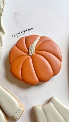 some cookies that are shaped like pumpkins