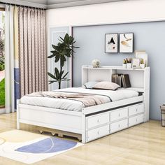 a bedroom scene with focus on the bed and dressers in the foreground, and an open patio door to the back yard