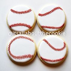 four decorated cookies with red and white baseballs on them, all in the shape of a ball