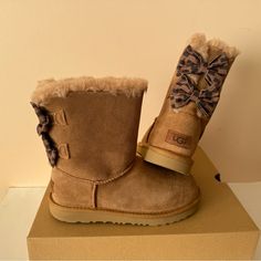 Ugg Customizable Bailey Bow Ii Genuine Shearling Graphic Boots. Size: 3 (Big Girl) New In Box. Suede Leather Upper Uggplush Wool Lining (80% Wool , 20 % Lyocell) Big Graphic Bows Foam Footbed Treadlite By Ugg Outsole For Comfort Woven Heel Label With Ugg Logo Cute Leather Boots For Winter, Cute Leather Winter Boots, Cute Leather Boots For Fall, Cute Brown Winter Boots, Graphic Boots, Ugg Bailey Bow, Chestnut Boots, Bailey Bow Uggs, Ugg Bailey