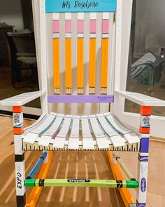 a chair made out of crayons and markers