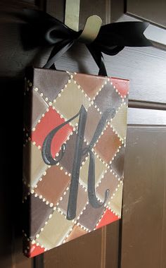 a door hanger with the letter k on it