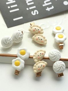 the brooches are made to look like they have eggs and ham on them