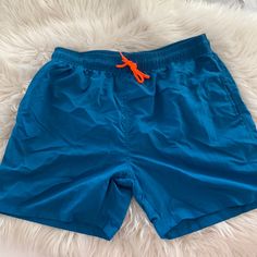 Nwot Peacock Blue Men’s Swim Trunks With Neon Orange Drawstring. Brand New. Never Worn But Husband Did Take Tags Off Thinking They Would Fit. Peacock Blue, Mens Swim Trunks, Man Swimming, Neon Orange, Swim Trunks, Blue Man, Swimming, Man Shop, Brand New