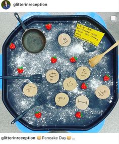 an image of a child's ice tray with letters and spoons on it