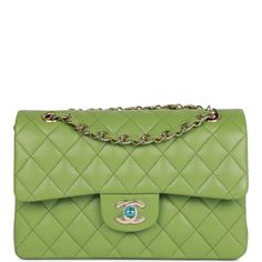 This Small Classic Double Flap bag is in Green caviar leather with light gold tone hardware and features a front flap with signature CC turnlock closure, half moon back pocket, and adjustable interwoven light gold tone chain link and green leather shoulder strap. The interior is lined in green leather with the "love letter" zipper compartment underneath the first flap, an "outer" slit pocket under the second flap, and an interior compartment with two open pockets separated by a "lipstick" compartment. Collection: 23C Origin: France Condition: Pristine, new or never (plastic on hardware) Accompanied by: Chanel box, Chanel dustbag, carebook, retail UPC and ribbon Measurements: 9" width x 5.25" height x 2.5" depth; 16.5" strap drop (9.5" doubled) Chanel Box, Handbag Wallet, Wallet Accessories, Sierra Leone, Green Leather, Flap Bag, Half Moon, Small Bags, Handbag Accessories