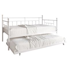 two white beds sitting next to each other on top of a bed frame with wheels