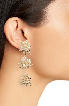 Sculptural dahlias are stationed along these golden drop earrings that are ever blooming. 3" drop; 1" width Surgical steel post back Recycled metal/cubic zirconia Imported Nordstrom Elegant Gold Jewelry, Elegant Nordstrom Gold Jewelry, Flower Drop Earrings, Earrings In Gold, Recycled Metal, Behind Ear Tattoo, Dahlia, Statement Earrings, Diamond Earrings