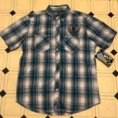 Nss Plaid Shirt Size Large New With Tags! Very Cool Skull And Wings Design On Chest Two Front Pockets Ships From A Smoke And Pet Free Home Reasonable Offers Welcome Blue Fitted Cotton Short Sleeve Shirt, Fitted Blue Cotton Short Sleeve Shirt, Blue Streetwear Shirt With Button Closure, Blue Button Closure Streetwear Shirt, Blue Button Closure Shirt For Streetwear, Casual Blue Cotton Short Sleeve Shirt, Casual Blue Short Sleeve Cotton Shirt, Casual Fitted Plaid Shirt, Fitted Casual Shirt For Streetwear