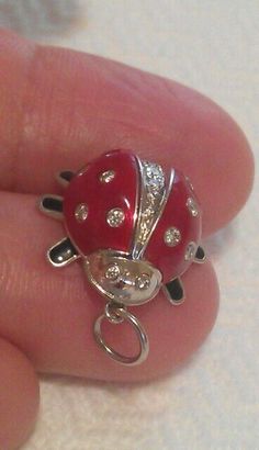 AUTHENTIC TIFFANY & CO. PLATINUM RED ENAMEL DIAMOND LADYBUG PENDANT NECKLACE  MATERIAL: Platinum THE PENANT WEIGHS: 7.5 grams (not including the cord) THE ENAMEL LADYBUG: Height/Length: 0.65", Width: 0.65" DIAMONDS: 18 round brilliant diamonds about .48TCW HALLMARKED: T & Co. PT950  CONDITION: Looks new recently serviced by store  I will include the new 18" black silk cord, the blue box. Silk Cord, Blue Box, Black Silk, Cute Jewelry, Tiffany & Co., Round Brilliant, Charm Pendant, Platinum, Diamonds