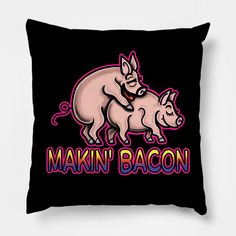 a black pillow with the words makin'bacon on it and two piggies