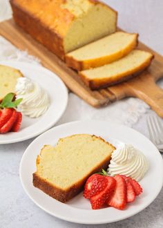 two plates with slices of pound cake and strawberries