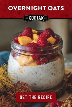 a jar filled with pudding and topped with raspberries