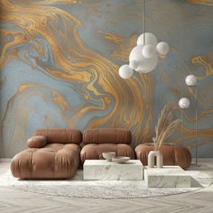 a modern living room with marbled walls and leather furniture