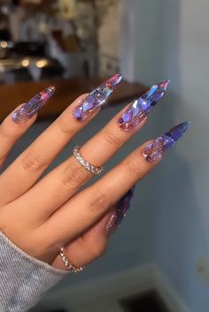 Clear Glitter Acrylic Nails, Long Acrylic Nails Stiletto Purple, Purple Geode Nails, Purple Glitter Gradient Nails, Purple Holo Nails, Iridescent Chunky Glitter Nails, Bedazzled Nails, Studded Nails