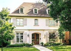 a large white house with lots of windows