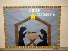 a bulletin board with the birth of jesus and baby jesus in a mangero