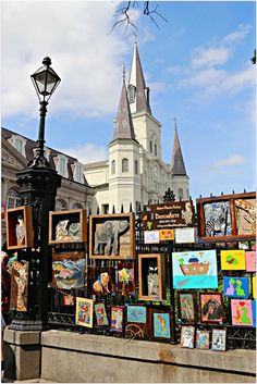 an art display in front of a large building