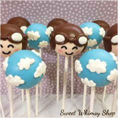 chocolate cake pops with blue and white clouds on them