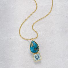 Mined in the Kingman turquoise mine in Arizona, the turquoise copper cabochon in the necklace is uniquely beautiful. It's paired with a square-cut blue topaz gemstone framed in goldplated sterling silver. The 0.875"L pendant comes on a goldplated chain that adjusts from 16"-18". Blue Topaz Pendant Necklace, Blue Topaz Gemstone, Blue Topaz Pendant, Topaz Pendant, Blue Topaz Earrings, Copper Turquoise, Ring Watch, Kingman Turquoise, Square Cut