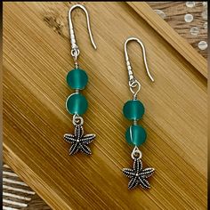 New Frosted Aqua Blue Bead Starfish Earrings With 925 Silver Ear Wire Hooks. Earrings Are 2 1/4 Inches Long. Handmade Silver Starfish Earrings, Nickel Free Silver Starfish Earrings, Nickel-free Silver Starfish Earrings, Silver Ocean-inspired Earrings With Starfish Charm, Ocean-inspired Silver Earrings With Starfish Charm, Silver Drop Earrings With Starfish Charm, Handmade Green Starfish Jewelry, Handmade Green Starfish-shaped Jewelry, Silver Starfish Shaped Beaded Jewelry