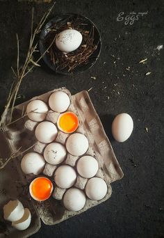 an overhead view of eggs in cartons on the ground