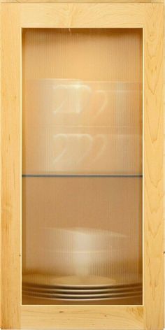 an empty wooden cabinet with glass doors on the front and back sides, in light wood