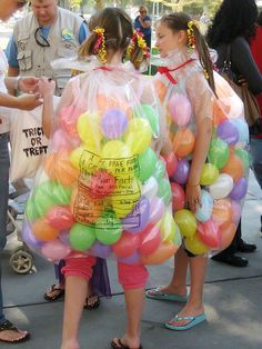 two girls in plastic bags with balloons on their back and the caption reads, use a black permanent marker to write the nutrition information