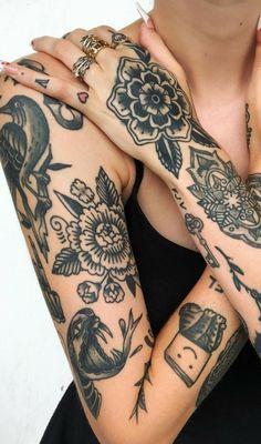 a woman with lots of tattoos on her arms