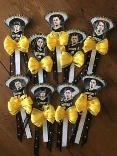 several yellow and black hair clips with pictures of elvis presley on them, all tied together