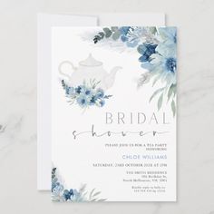 the bridal shower card features blue flowers and a white teapot on it, along with greenery