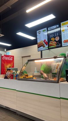 the food counter is clean and ready for customers to order at this convenience store,