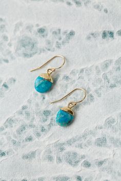 The Surrender Collection is soft and captivating. These simple turquoise earrings are finished with gold filled ear wires and are ideal for pairing with other items from the collection. Gold Filled (nickel and lead-safe) Turquoise 1", with gold filled ear wires We hand select our natural materials, thus there may be slight variations in color and/or size that will not detract from the overall aesthetic Our unique handcrafted designer jewelry for women is made in America, each design created indi Turquoise 14k Gold Filled Earrings For Everyday, Everyday Turquoise 14k Gold Filled Earrings, Turquoise 14k Gold Filled Earrings For Gift, Turquoise 14k Gold Filled Earrings As Gift, Gift Turquoise 14k Gold Filled Earrings, Blue Brass Jewelry With Ear Wire, Turquoise Jewelry With French Hook For Gift, Turquoise 14k Gold Filled Earrings, 14k Gold-filled Turquoise Jewelry With Ear Wire