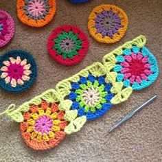 several crocheted grannys are arranged on the floor