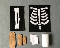 an assortment of medical items including bandages, gloves and a cast on a gray surface