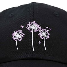 a black hat with purple dandelions embroidered on it