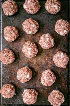 the meatballs are ready to be cooked on the baking sheet and put in the oven