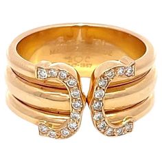 Estate C de Cartier Diamond Ring in 18K Yellow Gold. The ring features 22 brilliant round diamonds with approximately 0.16ctw. The rings is ring size 6, weighs 7.6 grams, and is 9mm wide. Stamped Cartier 750. Cartier Diamond Ring, Cartier Diamond Rings, Cartier Diamond, The Ring, The Rings, Cartier, Fashion Rings, Round Diamonds, Diamond Ring