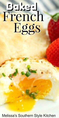 an egg and some strawberries on a white plate with the words baked french eggs