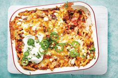 an enchilada casserole with sour cream and green peppers