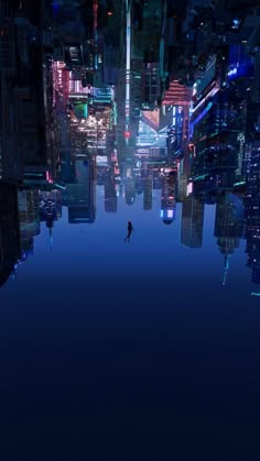 a man standing in the middle of a city at night with buildings reflected in the water