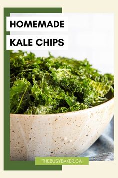 a bowl filled with kale chips on top of a table