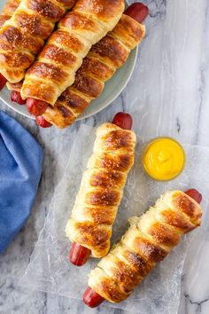 hotdogs wrapped in bread with mustard and ketchup