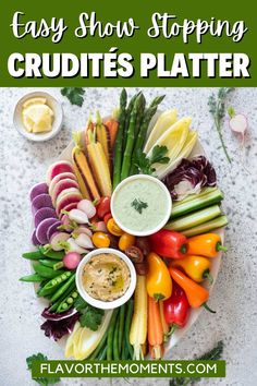 a platter filled with different types of vegetables and dips on top of it